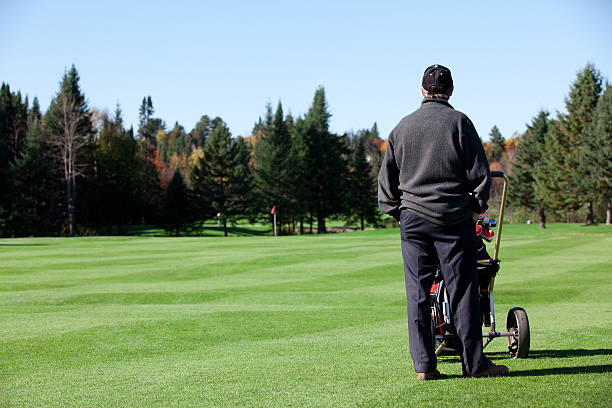 istock Senior Golf Player in Action in Autumn 183268952