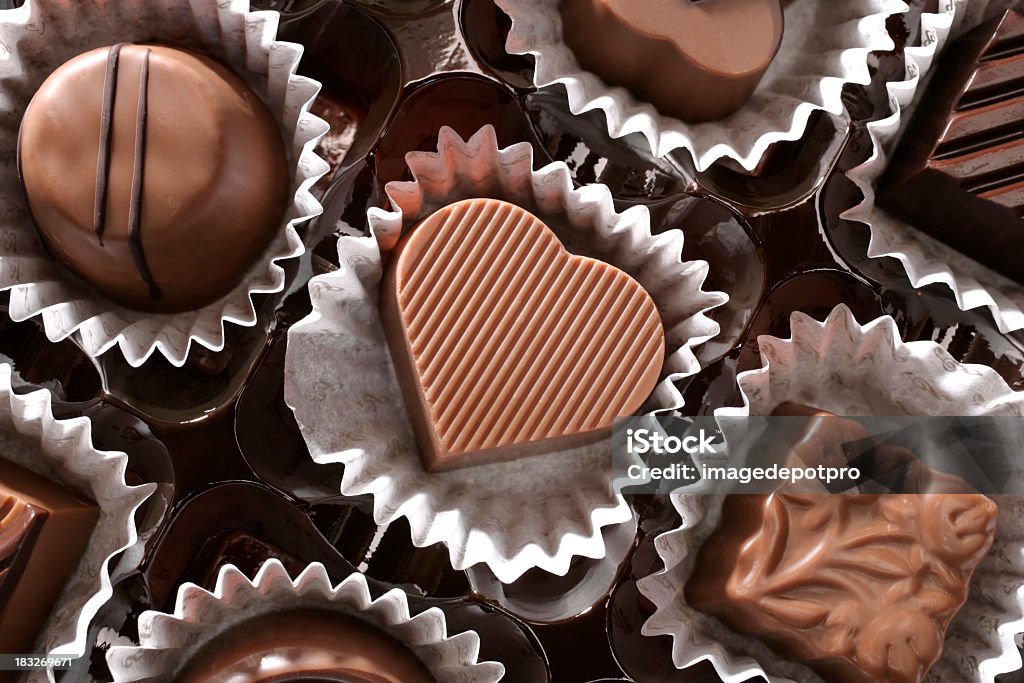 chocolates and love close up shot of chocolates in a row. Chocolate Stock Photo