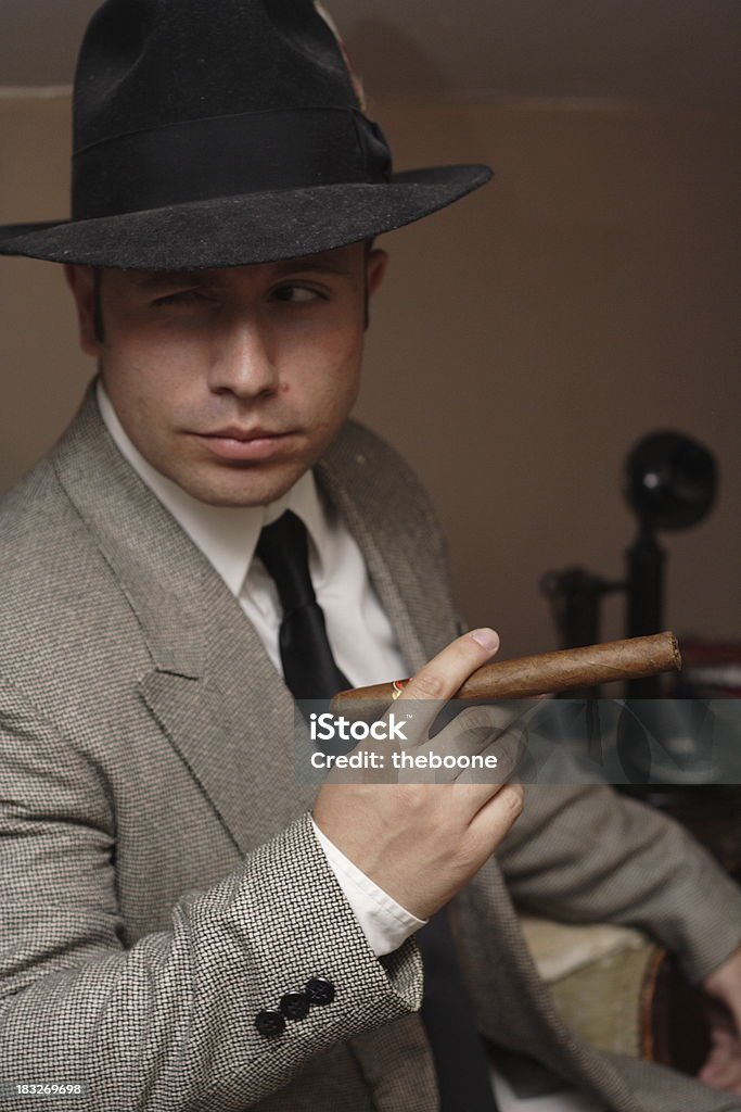 Mob Boss a 1940's mob boss with a cigar TV Reporter Stock Photo