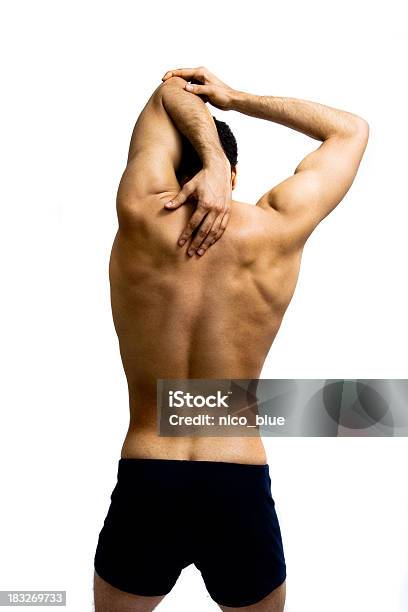 Estiramiento Foto de stock y más banco de imágenes de Hombres - Hombres, Espalda - Partes del cuerpo, Vista posterior