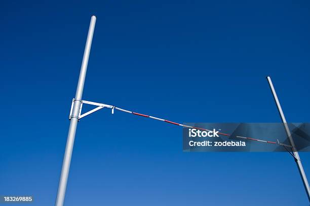 Pole Vault Against Blue Sky Stock Photo - Download Image Now - High Jump, Pole Vault, Horizontal Bar