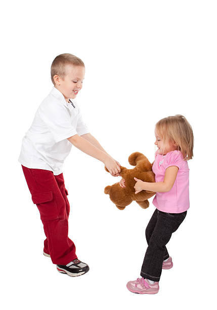 istock Children Fighting Over Toy 183270046
