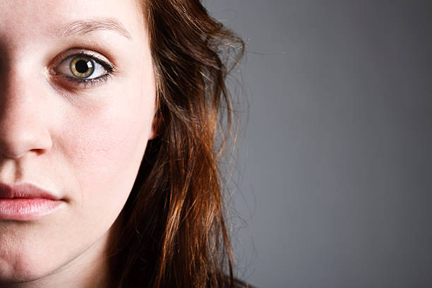 istock Cropped face of pretty redhead looking sad and serious 183270508