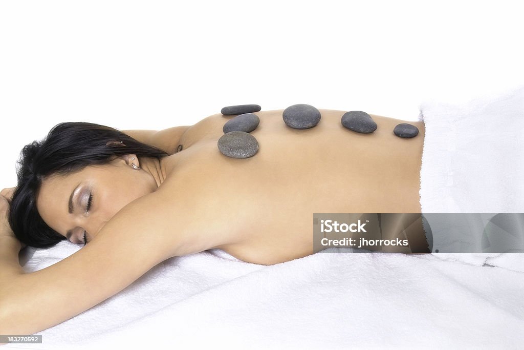 Lastone Therapy Photo of a young woman receiving a hot stone treatment. 20-29 Years Stock Photo