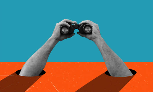 istock Art collage, hands holding binoculars on blue orange background. 1832711784
