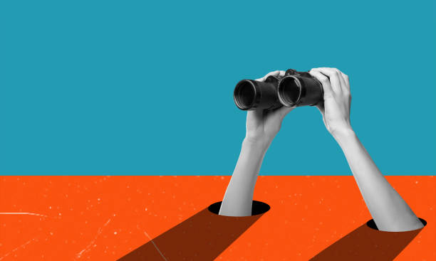 istock Art collage, hands holding binoculars on blue orange background. 1832712307