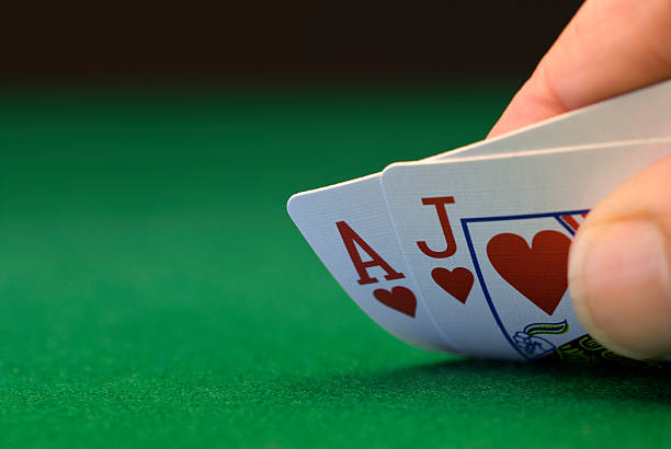 istock Ace and Jack of hearts on green baize 183271487
