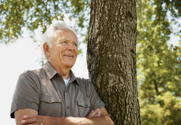 istock Daydreaming - Happy senior man looking away 183271590