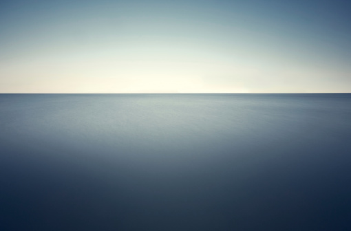 Long exposure shot of the deep blue sea. There is a bit noise in the picture.