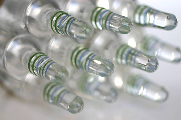 vaccine series 1b medicine ampoules on laboratory desk crista ampullaris photos stock pictures, royalty-free photos & images