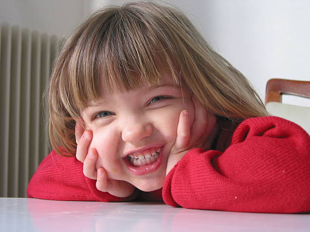 Portrait of beautiful young girl on the playground.