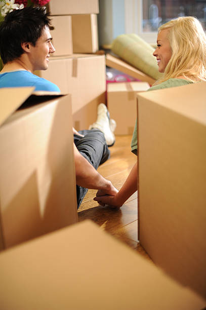 istock Young Couple Moving into a New Home 183272967