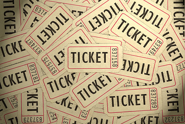 a background of a pile of tickets