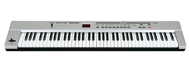 Midi keyboard on white Digital midi keyboard (6.5 octaves) isolated on white. synthesizer stock pictures, royalty-free photos & images