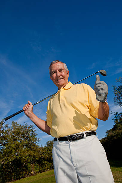istock Low angle view senior man golf club gesturing thumbs up 183273445