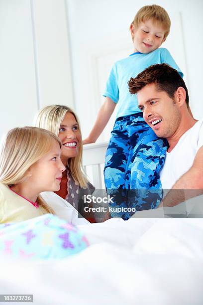 Middle Aged Couple With Their Children Spending Time Together Stock Photo - Download Image Now