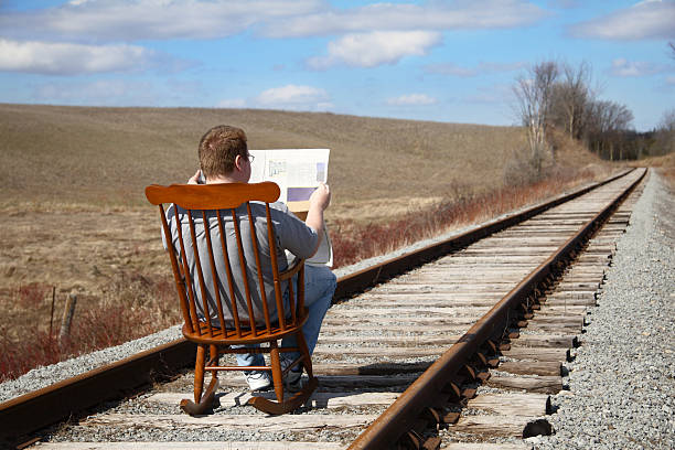 Complacency Gentleman who is oblivious to the risks around him. indifference stock pictures, royalty-free photos & images