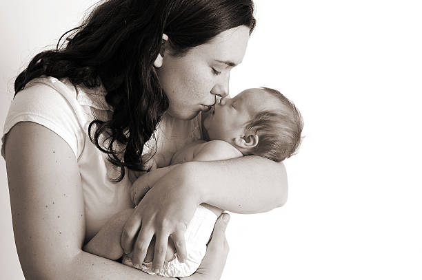 istock Loving Mother's Kiss (Room for Text) - Black & White 183274040