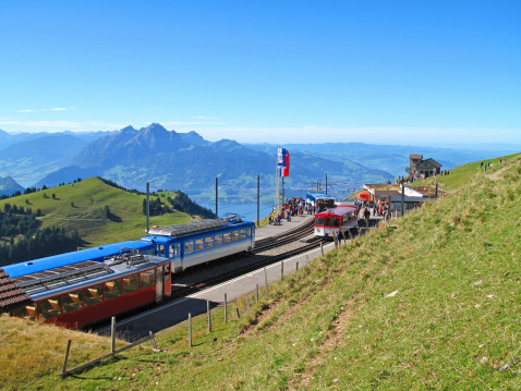 Cog railway train going to Schafberg summit. Transport in Alps mountain in Salzburger land. Tourism in Austria