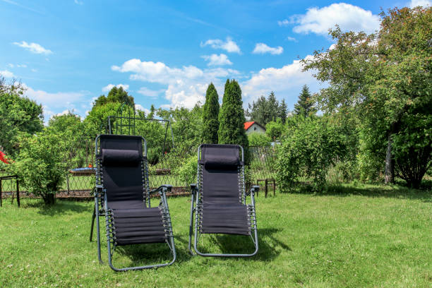 Folding deckchairs on the garden lawn summer in the garden