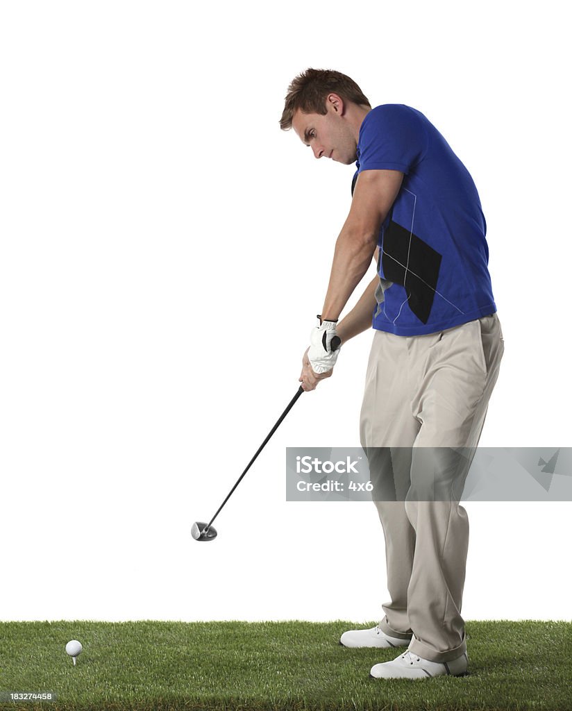 Golfista Tee off - Foto stock royalty-free di Abbigliamento casual