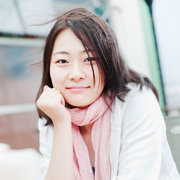 istock Asian lady wearing pink scarf 183274583