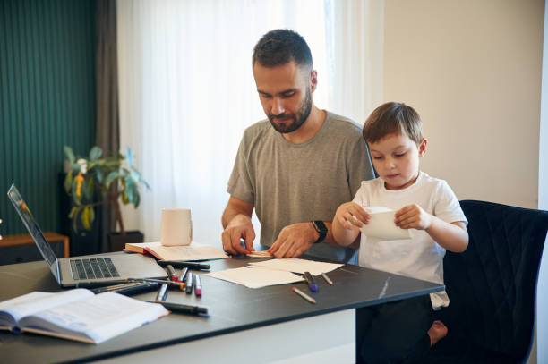 istock Father and son are at home by the table 1832746700