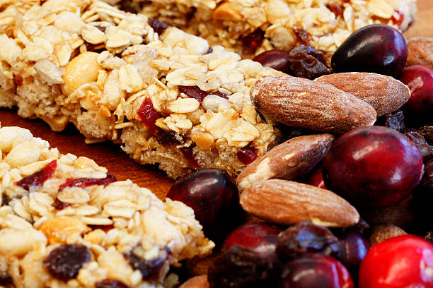 istock Granola Bars with Cranberries, Almonds and Raisins on Wood 183275146
