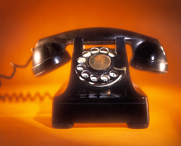 istock Antique Phone with bright yellow background 183275343