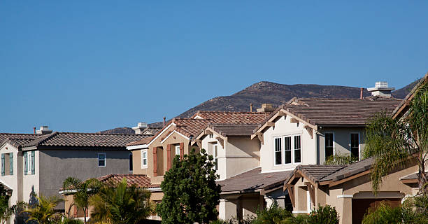 istock Neighborhood Stucco Home Exterior and Sky 183275762