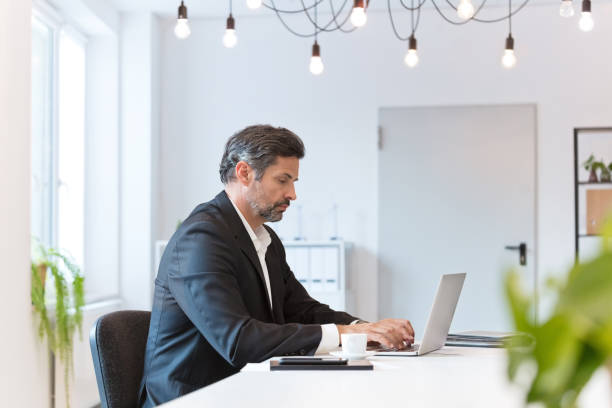 istock Businessman working at the table in an office 1832760522