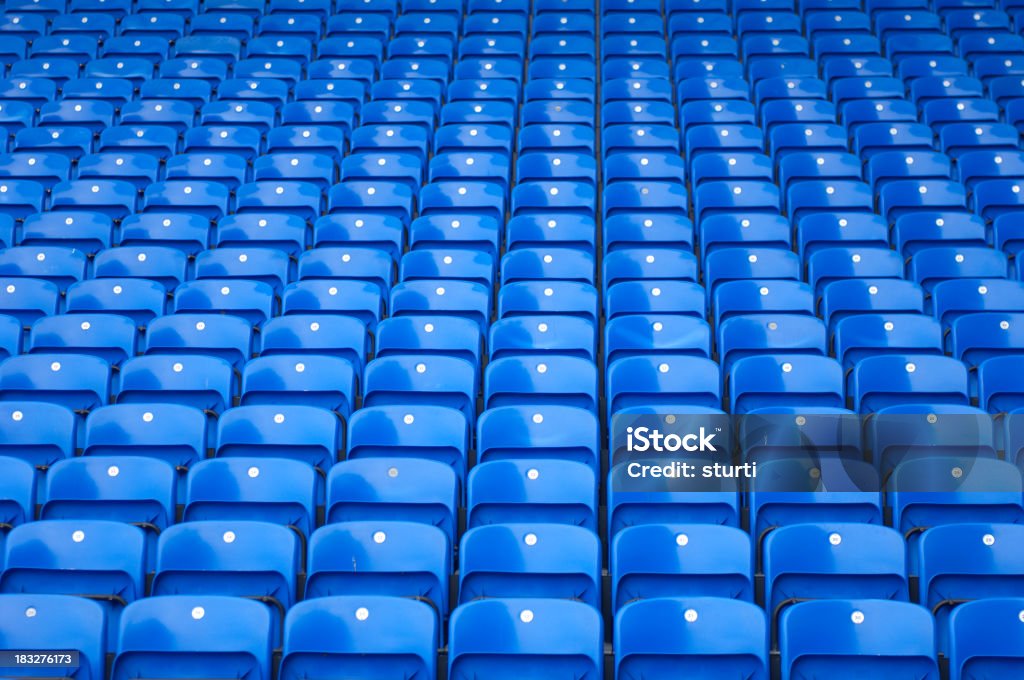 Blue Stadium Seating Multiple rows of spectator seating in a stadium. Seat Stock Photo
