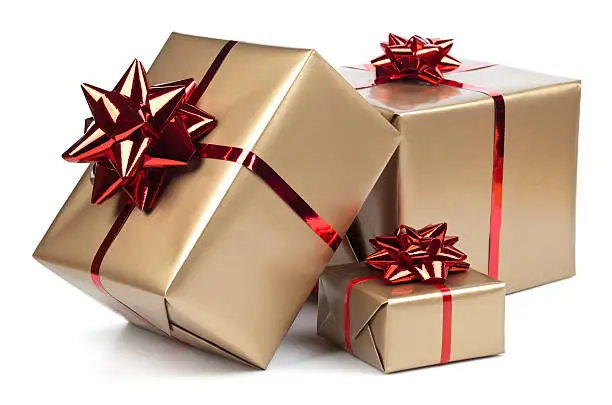 Gold gift boxes with red ribbon on white. This file contains