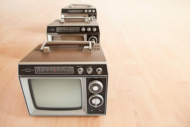istock Brown old televisions from the 1970´s in a row 183277240