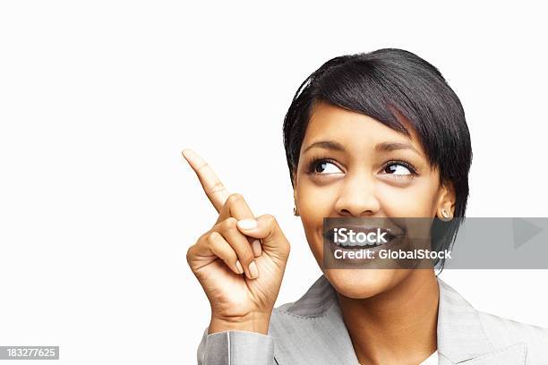 Happy African American Business Woman Pointing Upward Stock Photo - Download Image Now