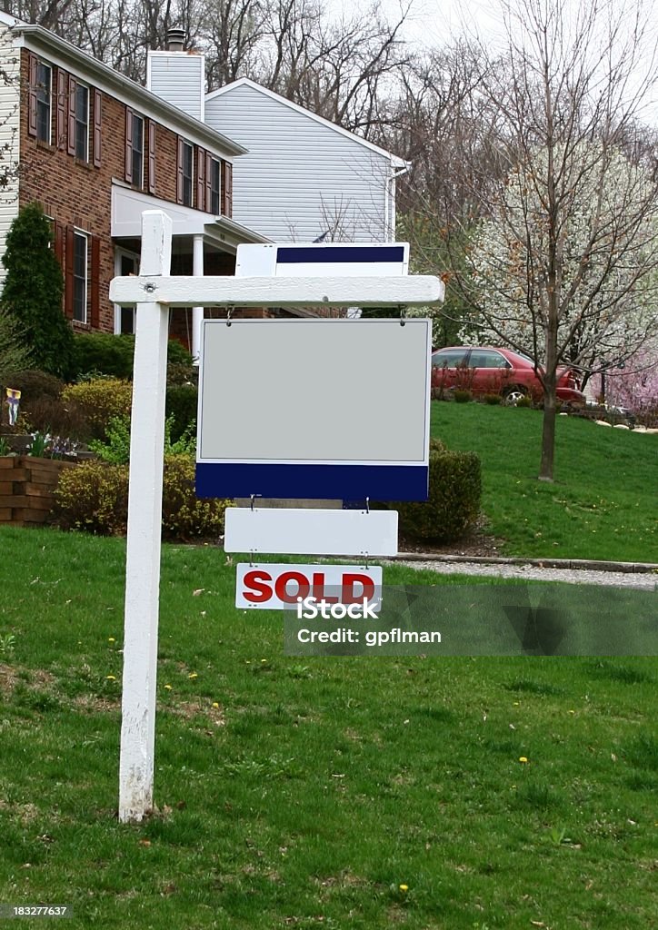 Blank Real Estate Sign Blank real estate sign with SOLD sign at the bottom in a residential neighborhood Blank Stock Photo