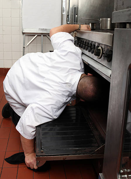istock Chef with his head in the Oven 183278149