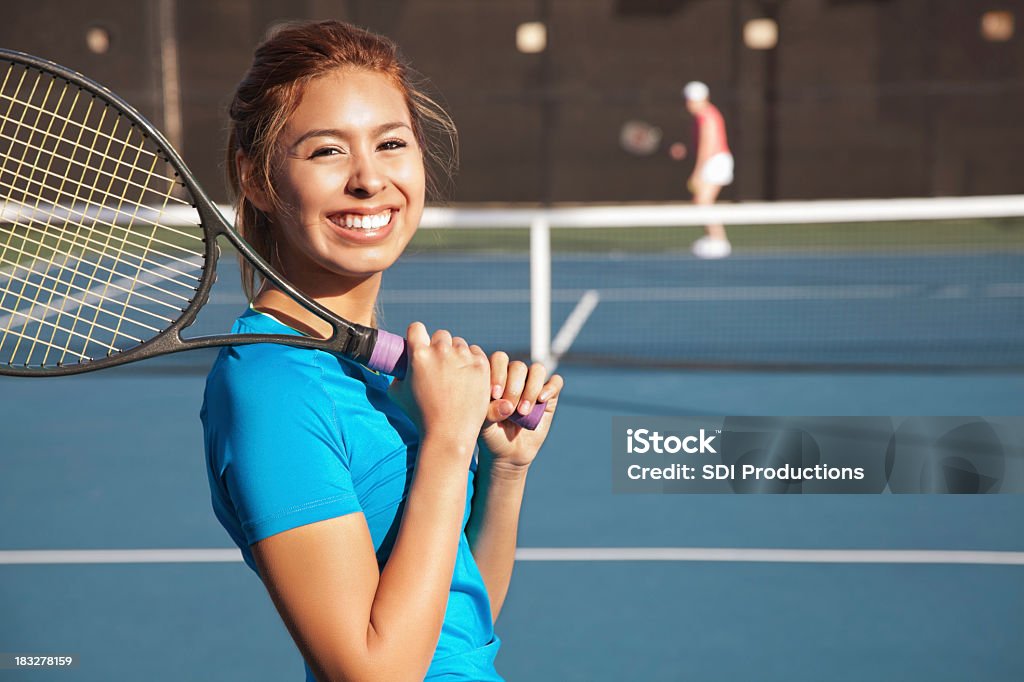 Pretty Teenage Tennis Player Playing a Match Pretty Teenage Tennis Player Holding A Racket and Playing a Match. Copy Space Available.See more from this series: Tennis Stock Photo