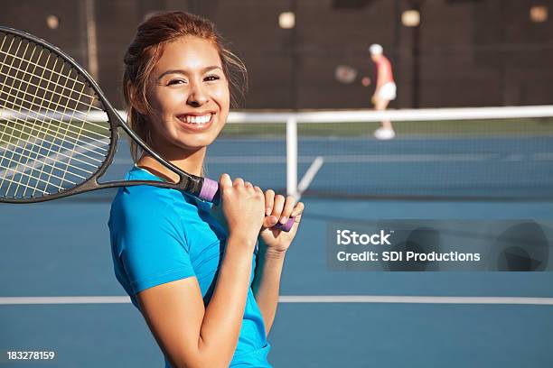 Pretty Teenage Tennis Player Playing A Match Stock Photo - Download Image Now - Tennis, Teenager, Athlete