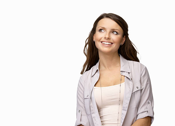 istock Smiling young woman looking away against white background 183278177