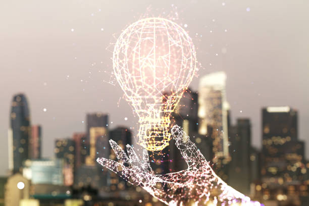 istock Abstract virtual light bulb hologram on blurry office buildings background, idea concept. Multiexposure 1832782740