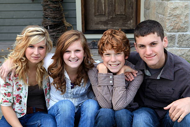 istock Siblings Together In Front of Their Home 183278388