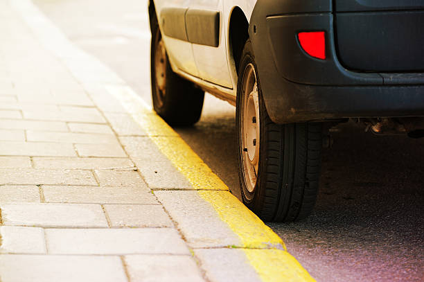 istock Car parked next to sidewalk with yellow line 183278684