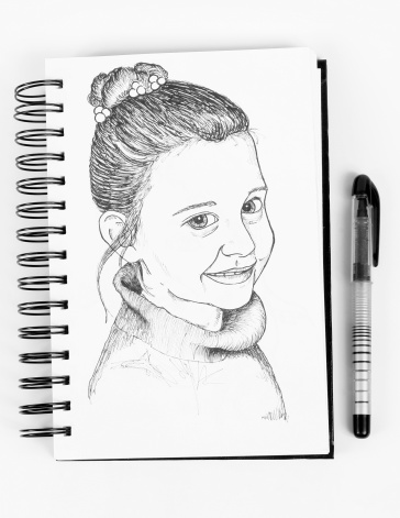 An ink portrait drawn in a sketch notebook.