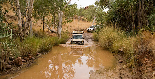 Bungle Bungles Crossing 4WD vehicles crossing one of the many rivers on the way into the Bungle Bungles (Purnululu National Park) in northern Western Australia. kimberley plain stock pictures, royalty-free photos & images