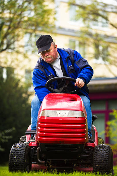 istock German Landscaper Starting His Riding Mower 183279285