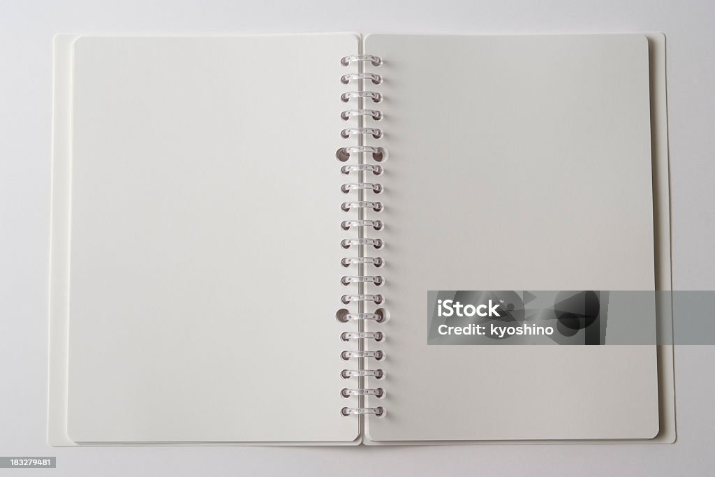 Isolated shot of opened blank spiral notebook on white background Opened blank spiral notebook isolated on white background. Arts Culture and Entertainment Stock Photo