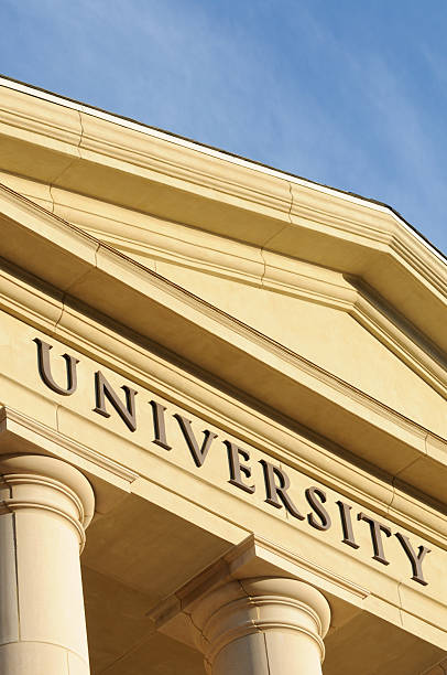istock University sign above hall columns with copy space 183279990