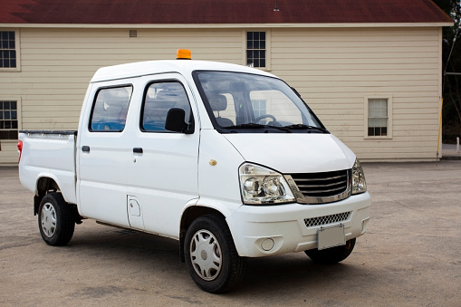 White mini truck-van for government use. Horizontal.