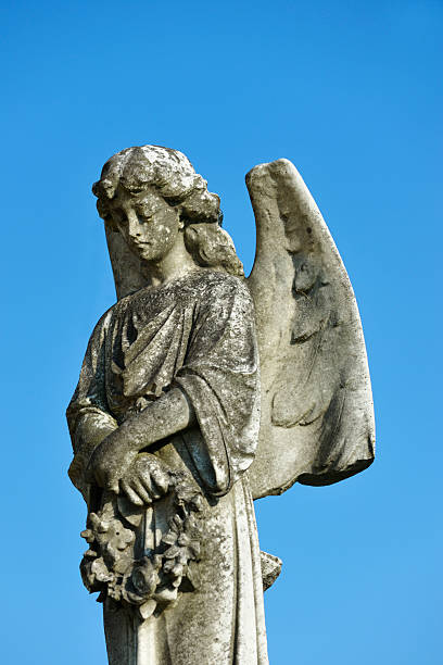 istock Carved stone statue in an old Scottish cemetry 183280080